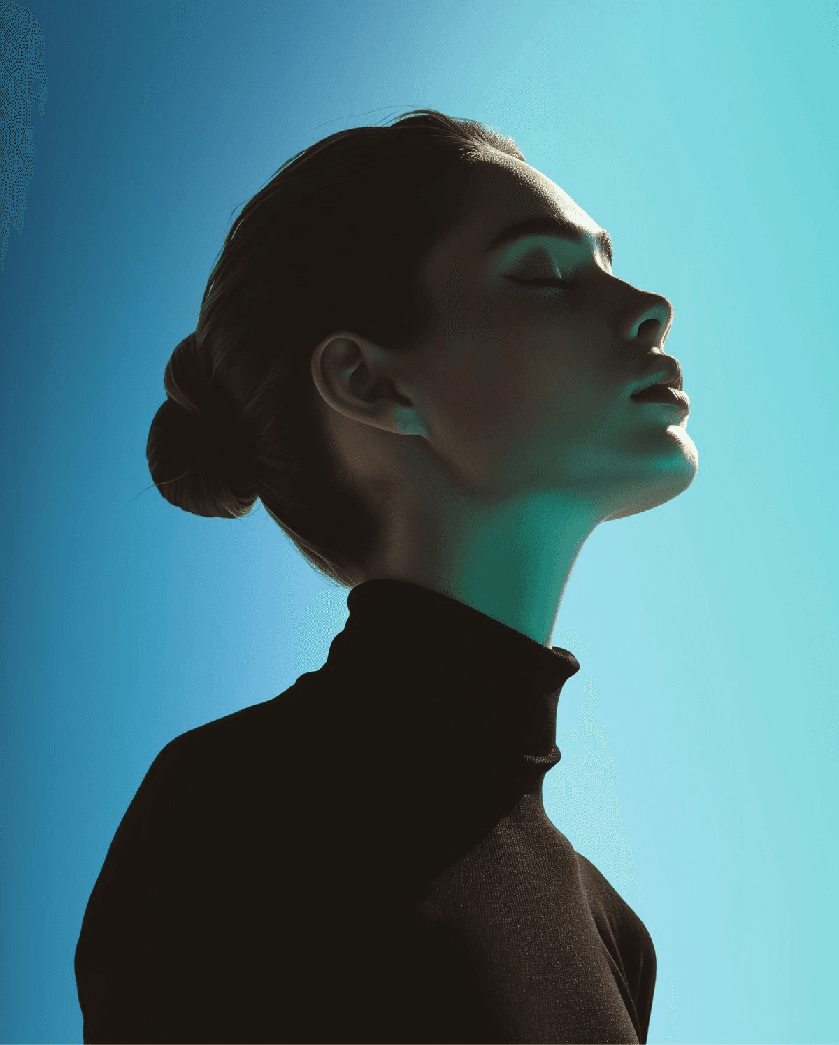 A figure lit in cool blue, face turned toward the light